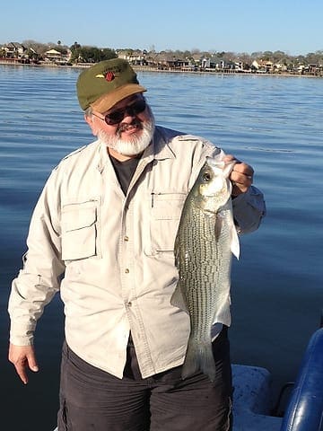 Andy Phillips hoists a nice hybrid Sunday on Lake Conroe. Photo by LSON. andy