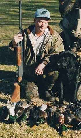 Richard, one of his dogs and a mess of ducks. Photo by Richard Pulvino. aduit1061