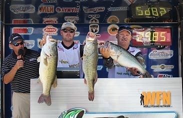 Trent Huckaby and Tyler Young hold up their catch from the Bass Champs event on Lake Falcon May 19. Photo by Bass Champs. bassc