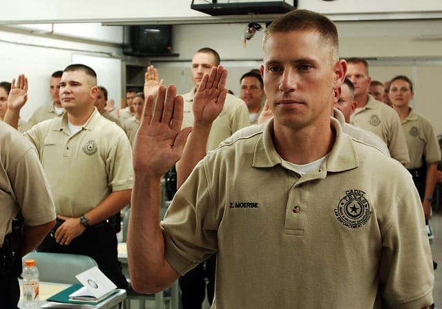 SWEARING TO SERVE: A recent class from the Texas Game Warden Academy prepares to assume duty. Photo by TPWD. cadet