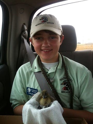 FOR THE FUTURE: Drake Rosser holds one of his ducklings that he is raising. He plans to release the birds in the coming weeks. Photo by Becky Rosser. ake2
