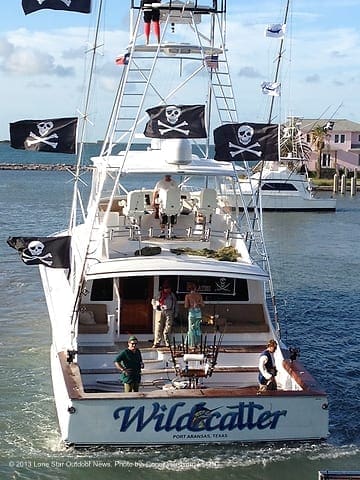 COMING TO THE DOCKS: The crew of the Wildcatter, decked out in pirate gear, returns from a successful day. Photo by Conor Harrison, LSON. aacwildcat